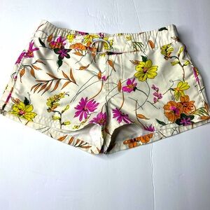 Flowery Girls swim trunks. Beige, pink, yellow, and orange.